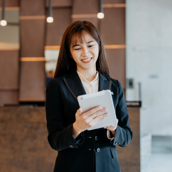 Woman holding a tablet contacting FutureLog