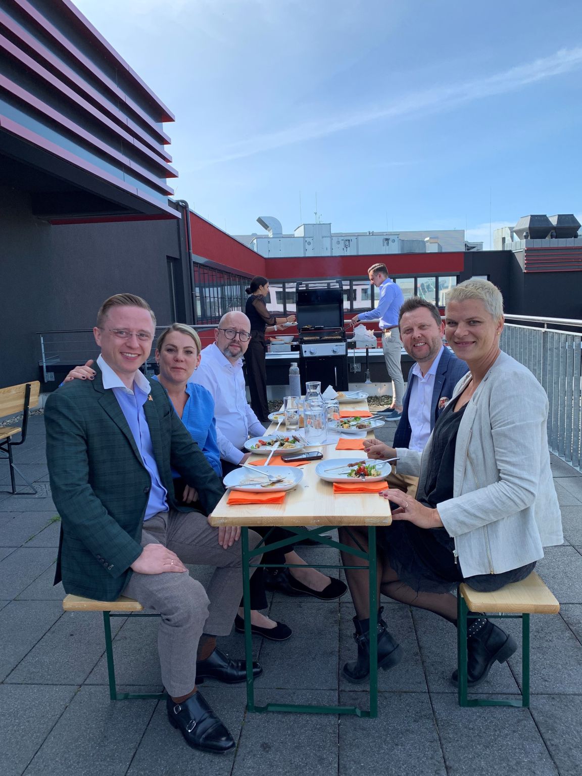 FutureLog team members eating lunch together outdoors on office terrace in Böblingen