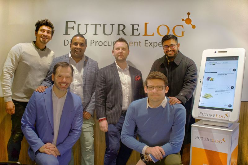 FutureLog Oceania team members standing in their Sydney office and displaying a giant iTab